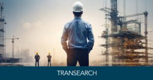 Construction worker looking to a construction in the background, standing tall